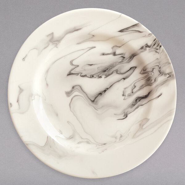 A white Reserve by Libbey porcelain plate with black and white marble swirls.