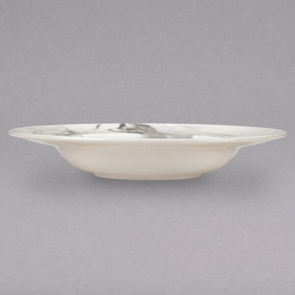 A white porcelain bowl with a marble swirl.