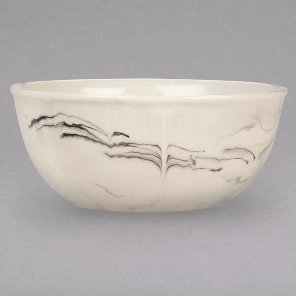 A white porcelain bowl with black swirls.