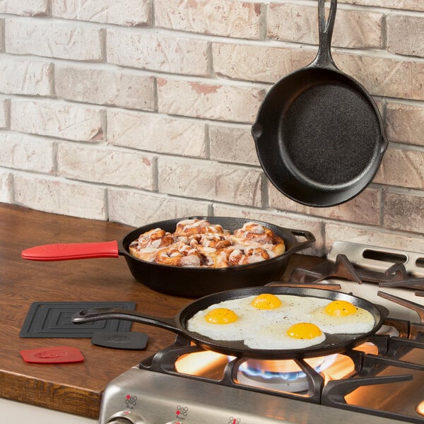 Lodge 7-Piece Essential Pre-Seasoned Cast Iron Skillet Set - Includes 8  and 10 1/4 Skillets, 10 1/2 Griddle, Silicone Handle Holder, Silicone  Trivet, and Two Pan Scrapers