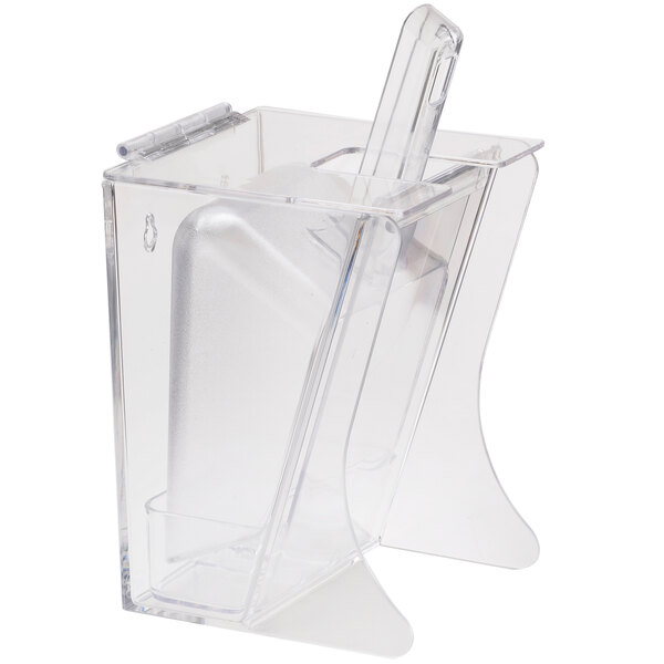 A Cal-Mil freestanding clear plastic scoop holder with a clear scoop inside.