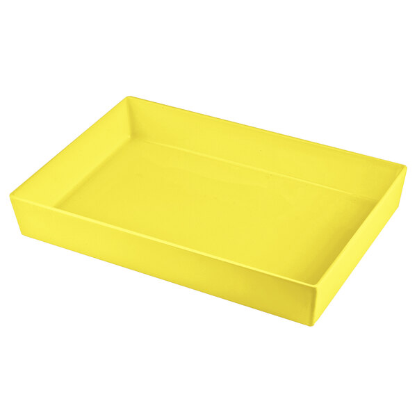 A yellow rectangular cast aluminum bowl on a white background.