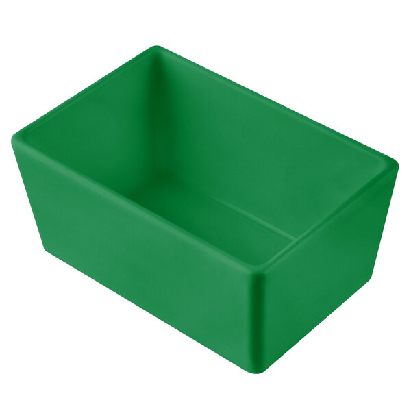 A green rectangular Tablecraft bowl on a counter.