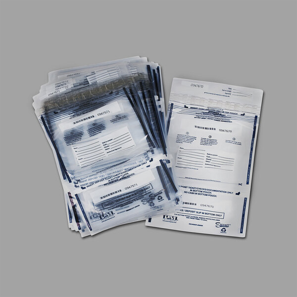 A stack of clear plastic PM Company dual deposit bags with black writing.