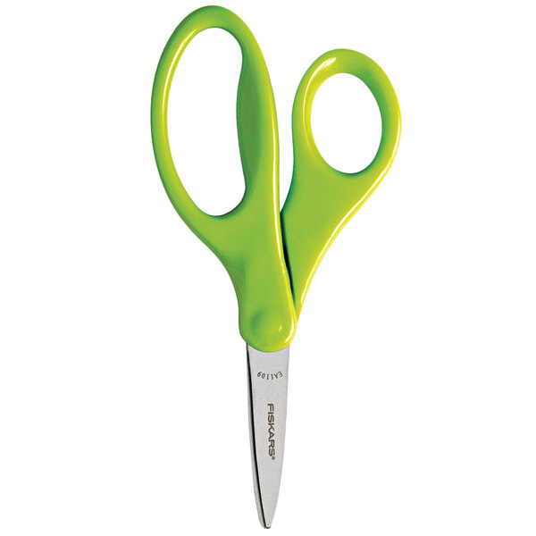 A close-up of a pair of Fiskars scissors with green handles.