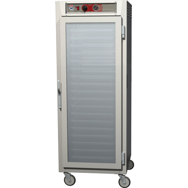 A white Metro C5 series heated holding cabinet with clear and solid glass doors.