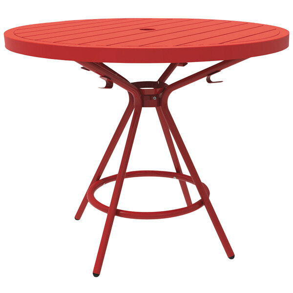 A red round Safco CoGo steel table with legs.
