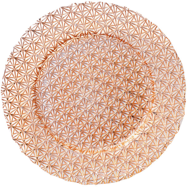 A Bon Chef rose gold glass charger plate with a geometric pattern.