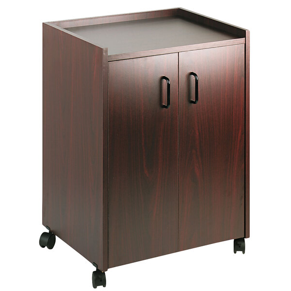 A mahogany laminate Safco mobile refreshment center with two doors and two drawers with black handles.