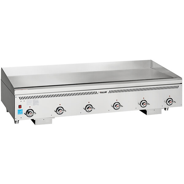 A Vulcan stainless steel gas griddle on a counter with four burners.