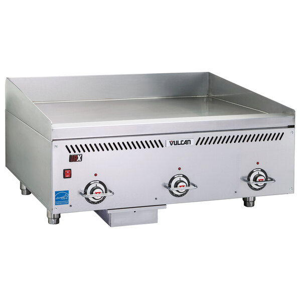 A stainless steel Vulcan commercial griddle with two atmospheric burners and a large metal surface.