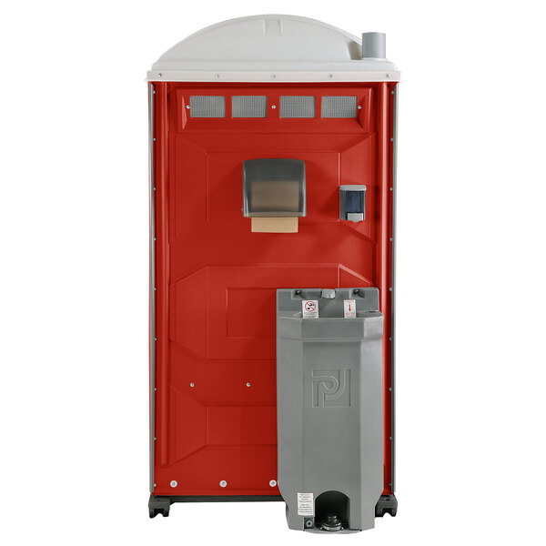 A red and grey PolyJohn portable toilet.
