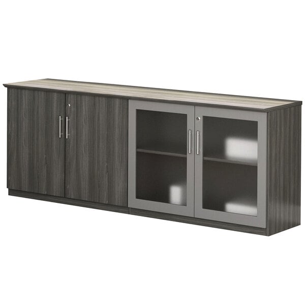 A grey Safco Medina low wall cabinet with glass doors.