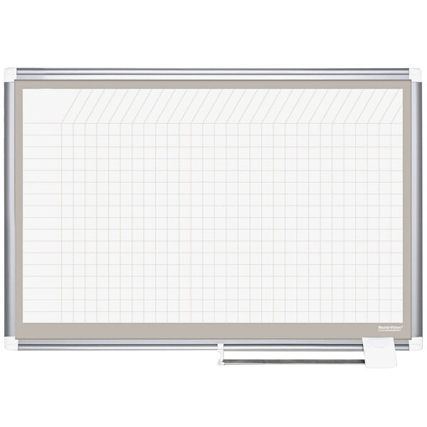 A white MasterVision planning board with a grid on it.