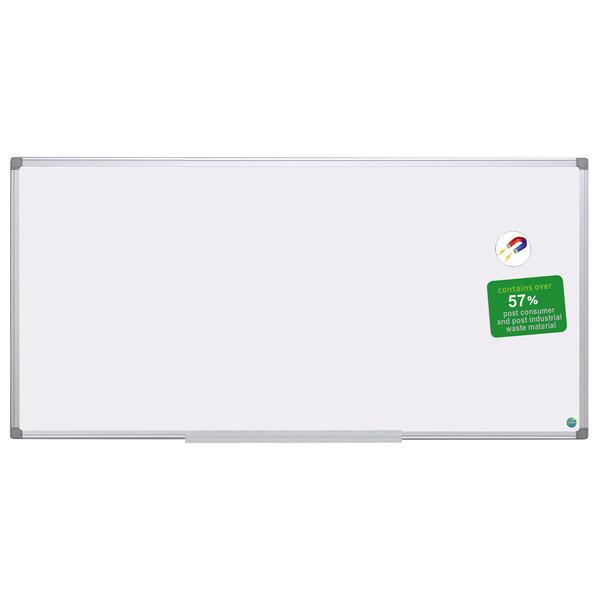 A white board with a green sticker on it.