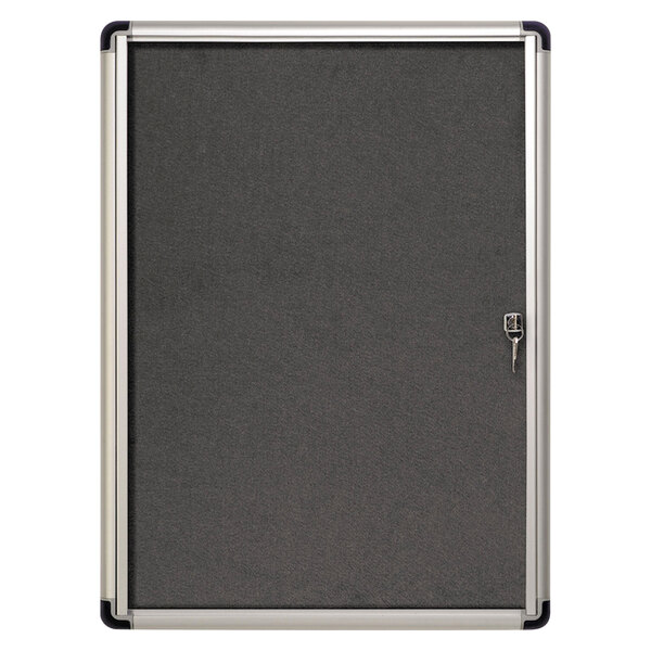 A black and silver MasterVision Slim-Line enclosed fabric bulletin board with a grey board and a key.