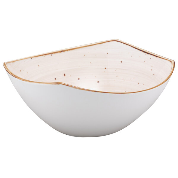 A white china salad bowl with brown specks.