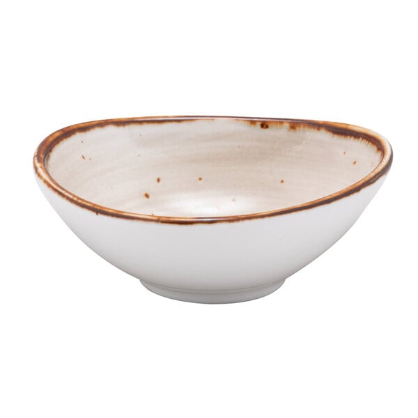 A white China saucer bowl with a brown rim.