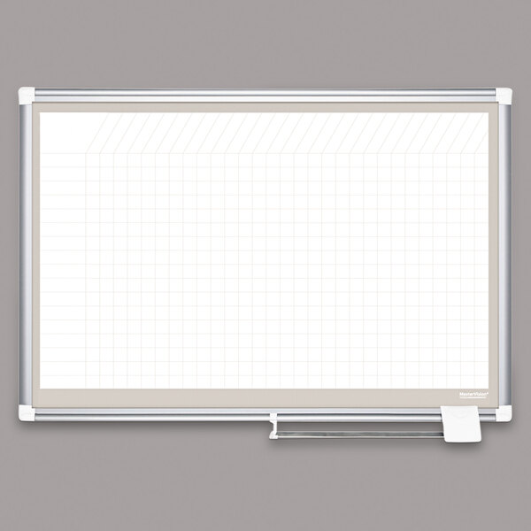A white board with graph paper on it.