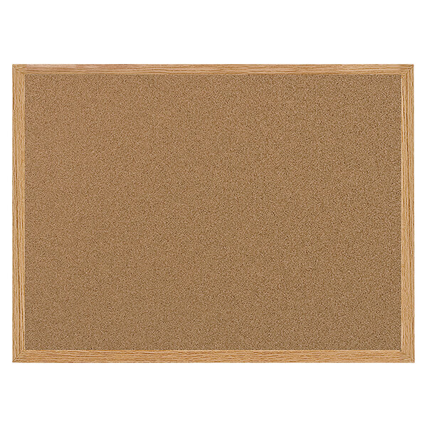 A MasterVision cork board with an oak frame.