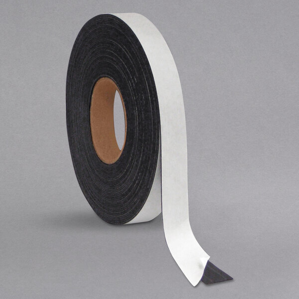A roll of black magnetic adhesive tape with white edges.