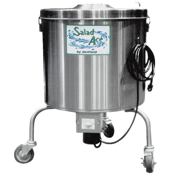A Delfield stainless steel salad dryer with a water pump on it.