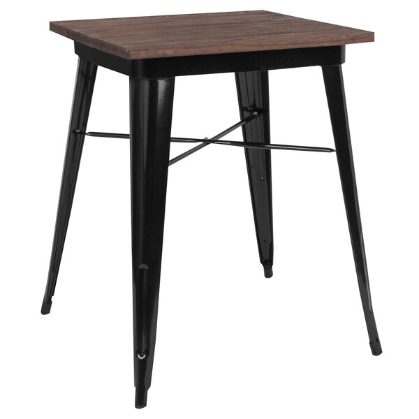 A Flash Furniture table with a wood top and black metal frame.