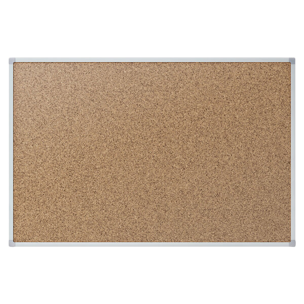 A Mead brown cork bulletin board with a silver aluminum frame.