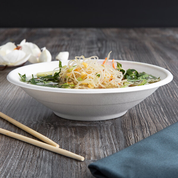 A white Eco-Products compostable noodle bowl with chopsticks on a table.