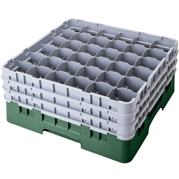 A stack of green plastic Cambro glass racks with extenders.