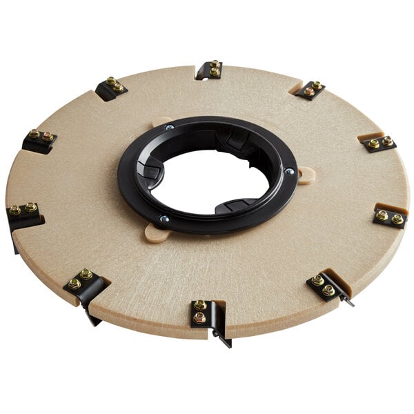 A circular black Minuteman polymer brush disc with screws.
