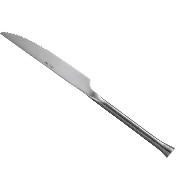 A Oneida Wyatt stainless steel steak knife with a long handle.