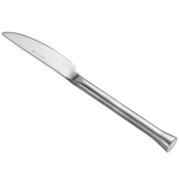 A Oneida Wyatt stainless steel butter knife with a long handle.