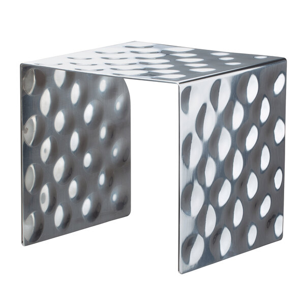 A Bon Chef stainless steel square showcase stand with a hammered surface and holes in it.