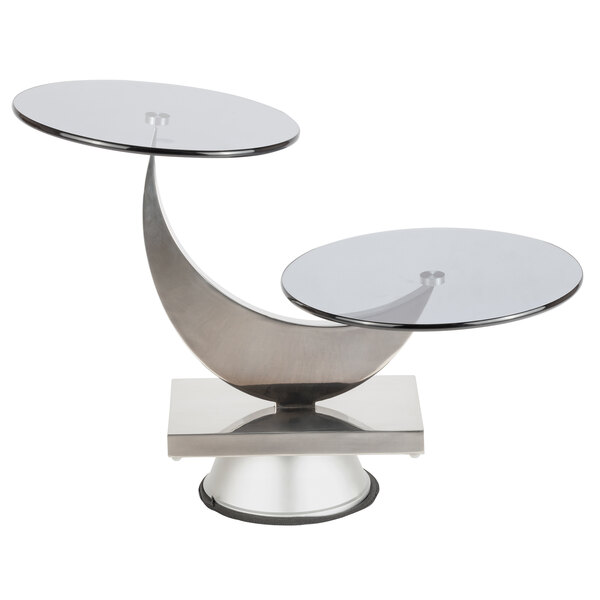 A Bon Chef stainless steel and glass moon display stand with two round glass tables on top.