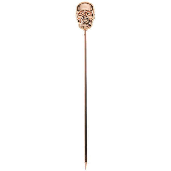 A copper-plated stainless steel cocktail pick with a skull top.