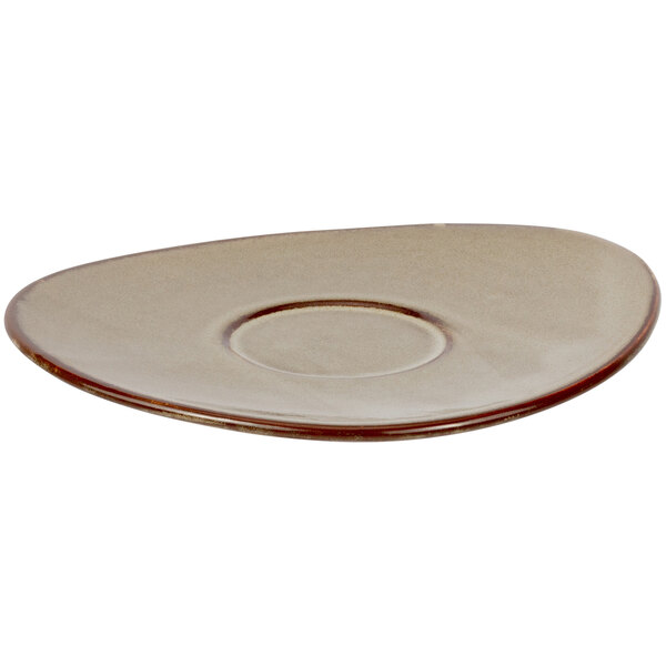 A brown porcelain saucer plate with a circle in the middle.