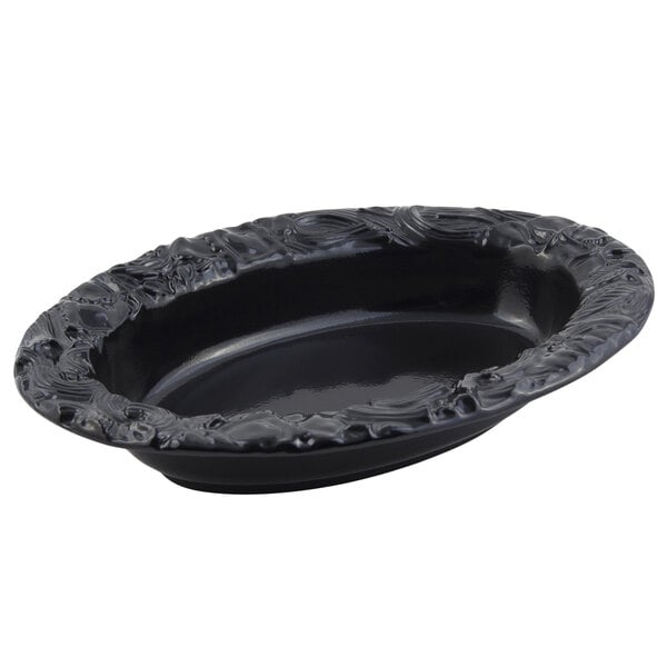 A black oval Bon Chef pasta bowl with a design on the side.