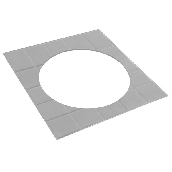 A white square tile with a circle in the middle.