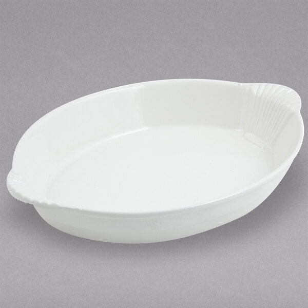 A white oval dish with shell handles.