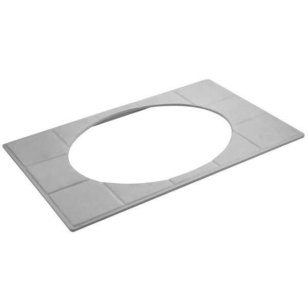 A white oval tile with a hole in the middle.