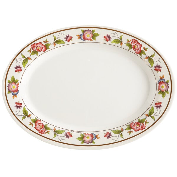 A white oval melamine platter with tea roses on it.