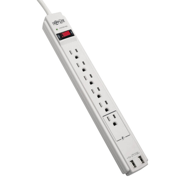 A close-up of a white Tripp Lite surge protector with multiple outlets and a red light on it.