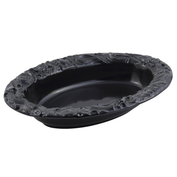 A black oval Bon Chef pasta bowl with a decorative design.