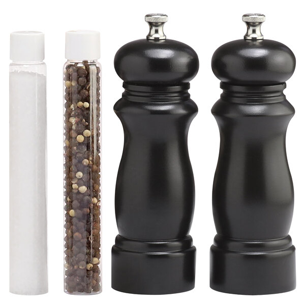A black Chef Specialties pepper mill with a black handle and black salt mill with a white lid.
