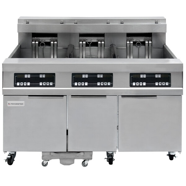 A Frymaster electric floor fryer with three units and filtration system.