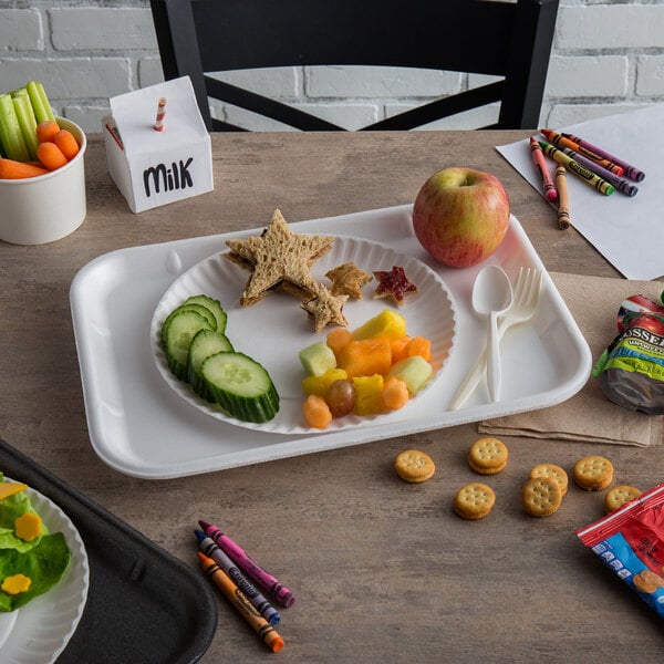 A white foam school tray with food, a spoon, and a fork.
