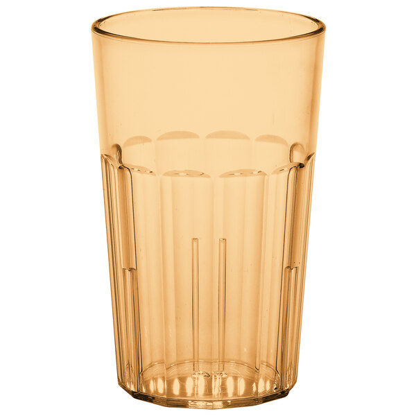 A clear plastic tumbler with a ribbed rim and brown accents.