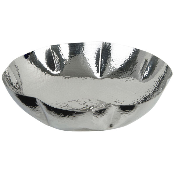 A close-up of an Eastern Tabletop stainless steel bowl with a wavy edge.