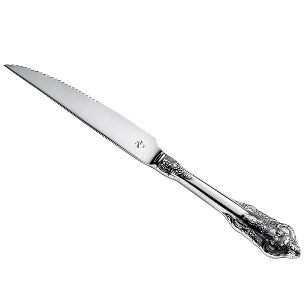 A silver steak knife with a stainless steel handle.